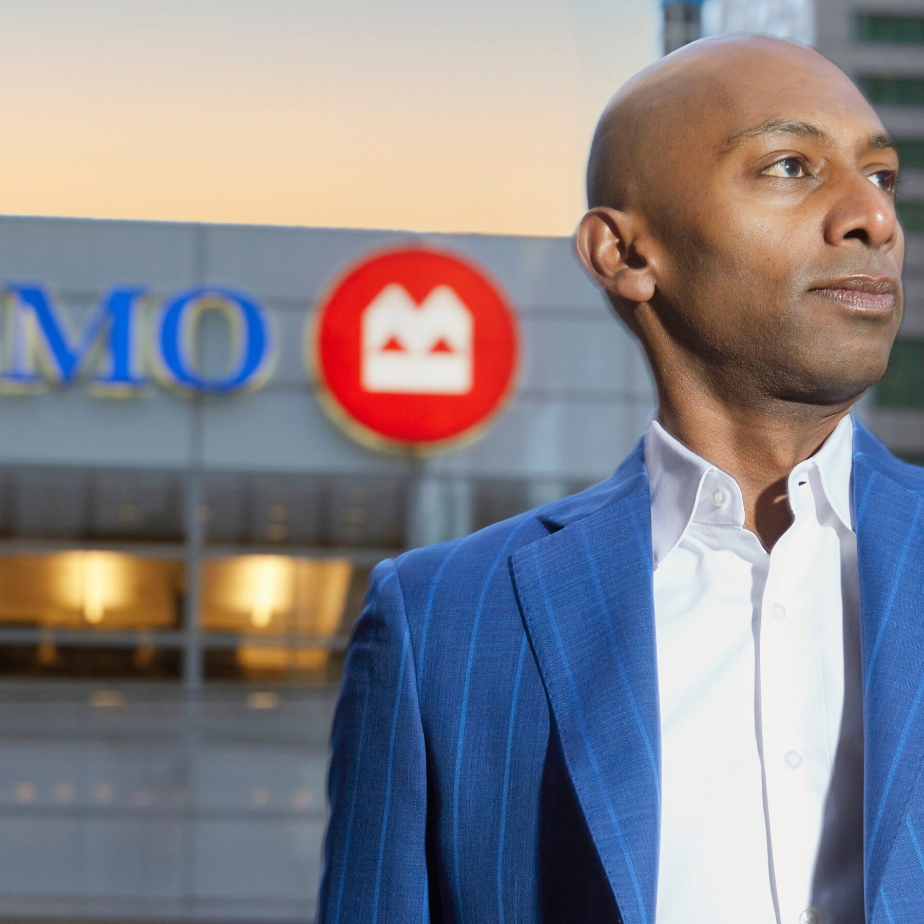 Rohit Thomas stands in front of a BMO sign