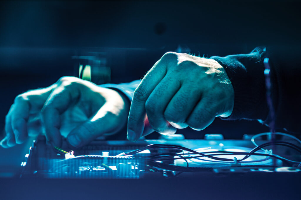 Hands assembling photonic components in a quantum computing setup, showcasing advanced technology related to Xanadu's innovations.